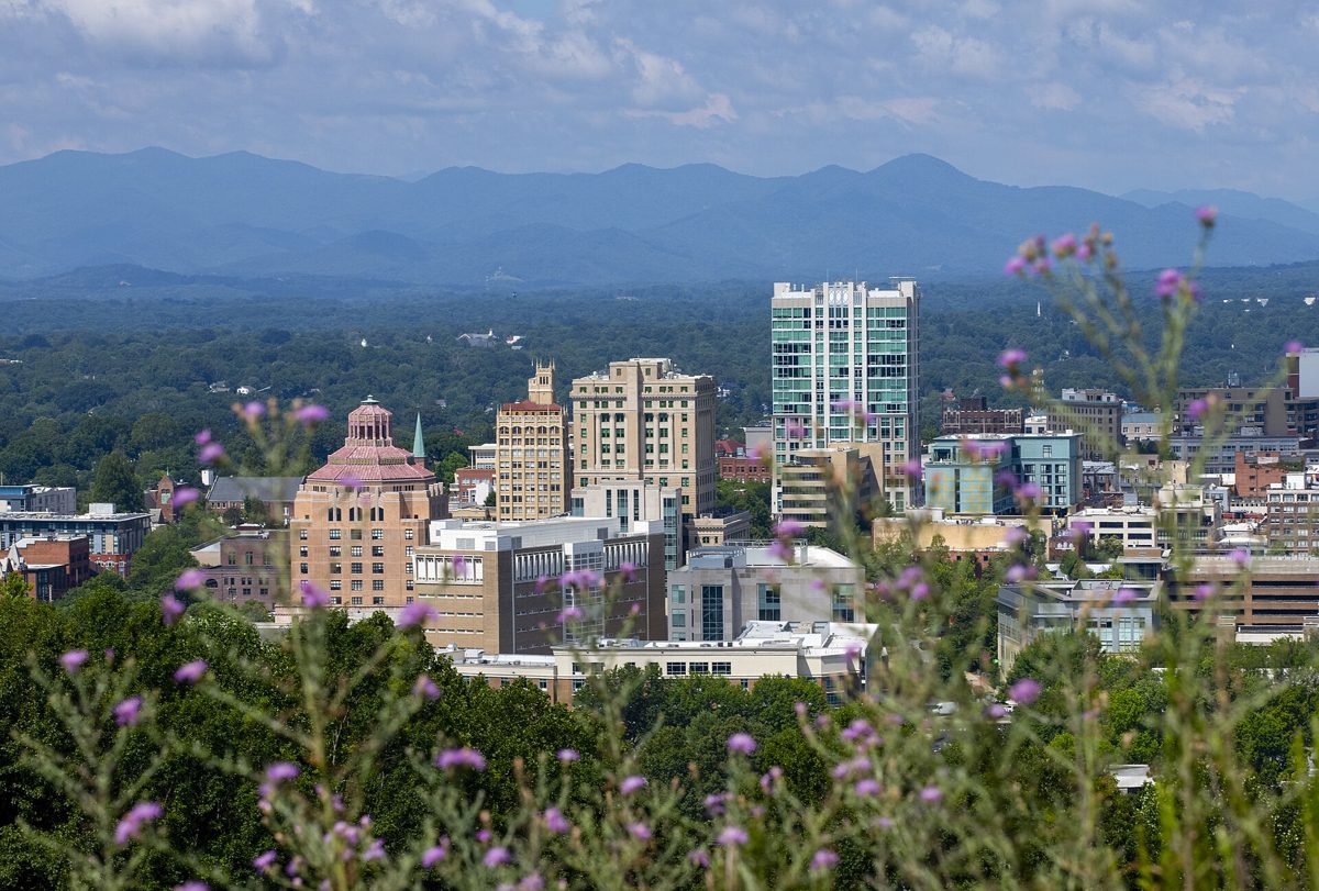 Downtown Asheville, North Carolina, with the Blue Ridge Mountains behind it